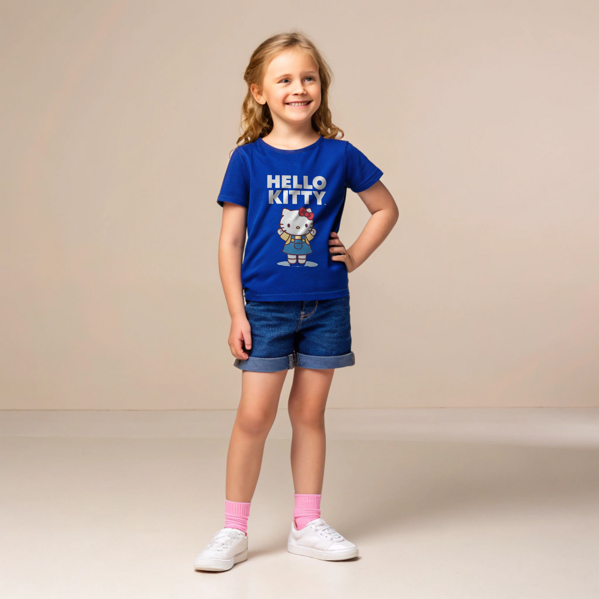 "Classic Hello Kitty in Blue Overalls – Cute Cartoon Design"
